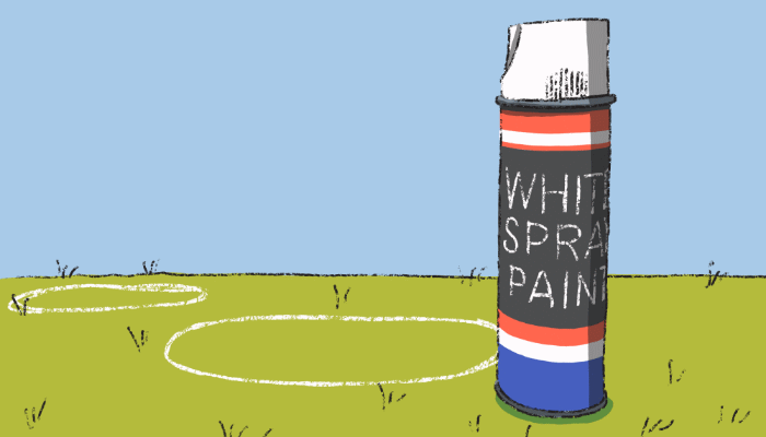 Spray paint can on ground