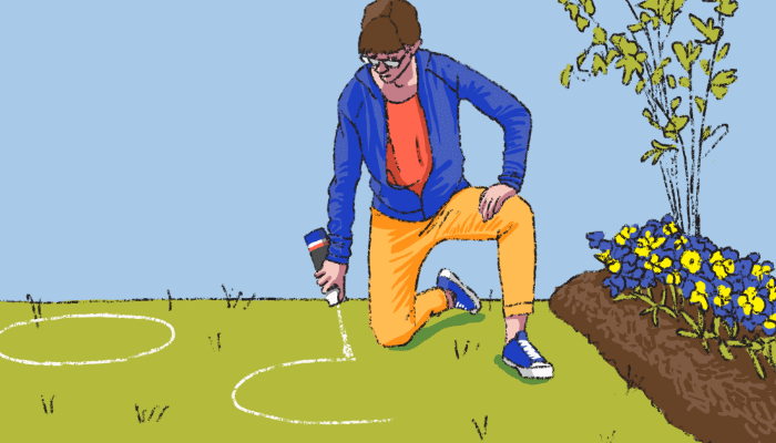 Woman drawing a white circle on a lawn